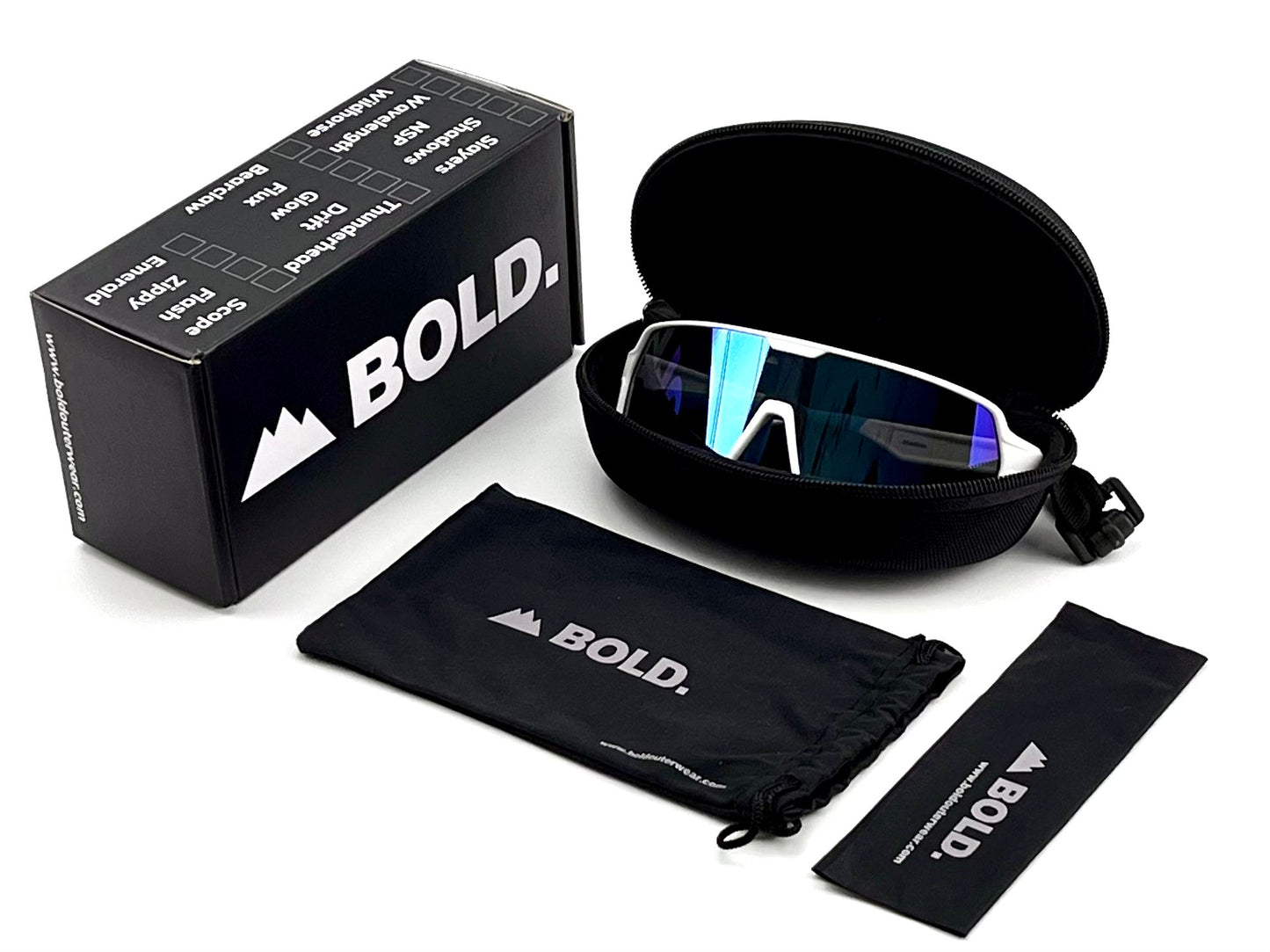 The BOLD Shadows Performance Sunglasses by boldouterwear feature a white frame and fixed-tint reflective lenses, displayed in a black zippered case. Also shown are a BOLD-branded box, drawstring pouch, and cleaning cloth—all with white logos on a white background.