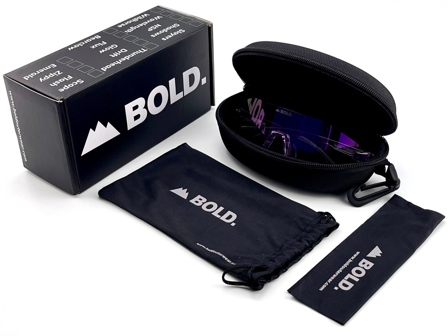 The BOLD Emerald Photochromic Sunglasses by boldouterwear feature light-adaptive lenses in purple-tinted sports frames, presented with a black box, hard zippered case, and two black pouches—each sporting the boldouterwear logo on a white background.