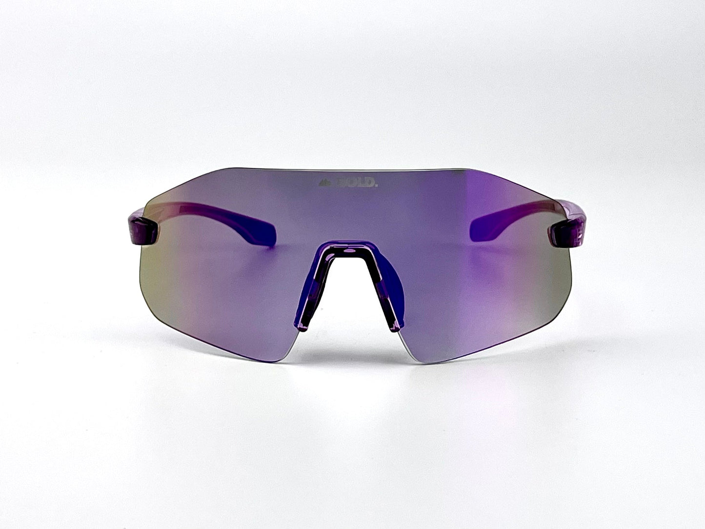 The BOLD Emerald Photochromic Sunglasses by boldouterwear feature a wide, mirrored purple light-adaptive lens, thin translucent arms, and an angular black nose piece—offering modern clarity for MTB, ski, and lifestyle wear against a minimalist white background.