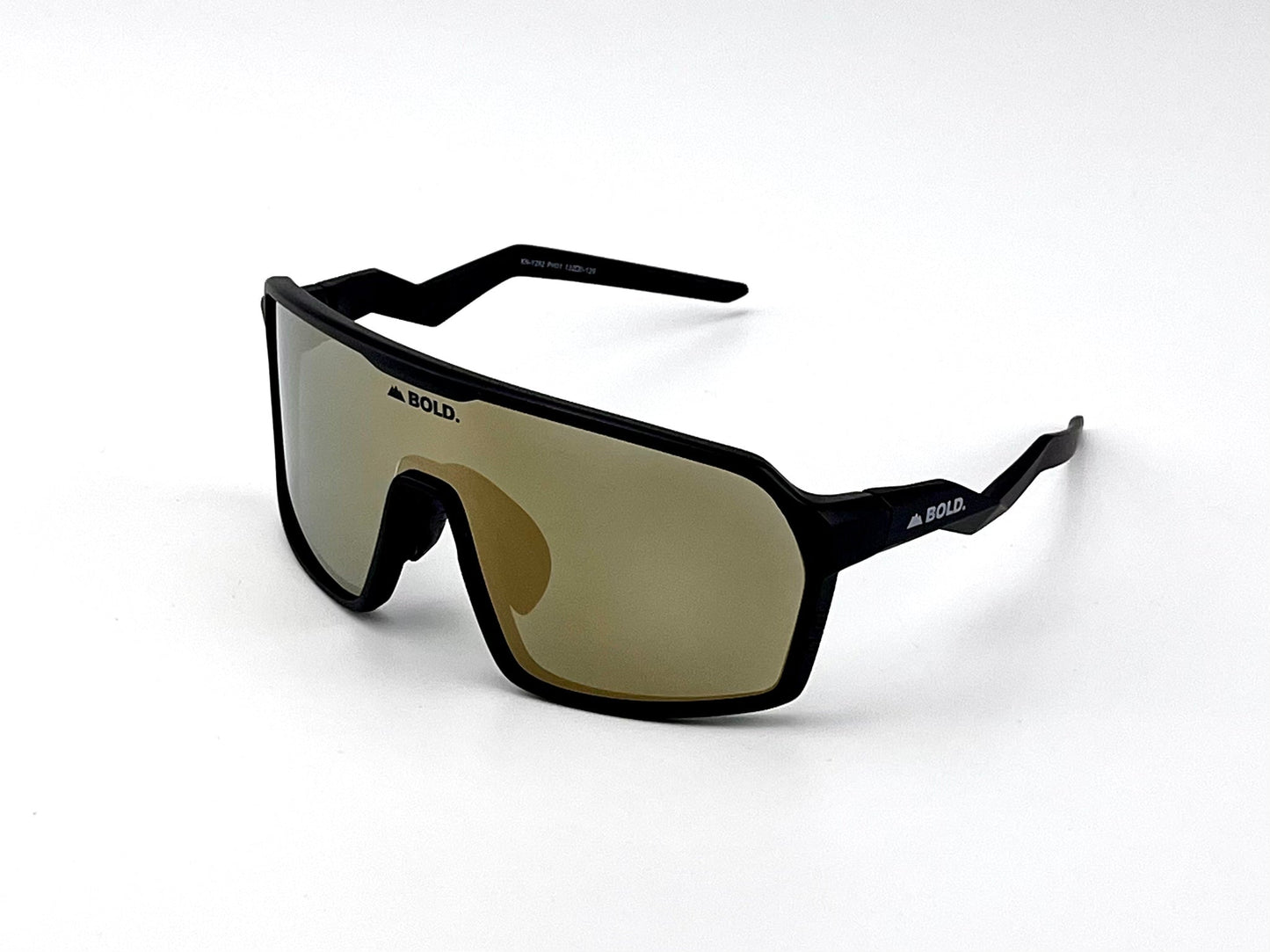 The BOLD Glow Photochromic Sunglasses by boldouterwear are sporty, oversized adaptive eyewear with a black angular frame, gold-tinted mirrored lens, and “BOLD.” logo on the top of the lens and arms. Photographed on a plain white background.