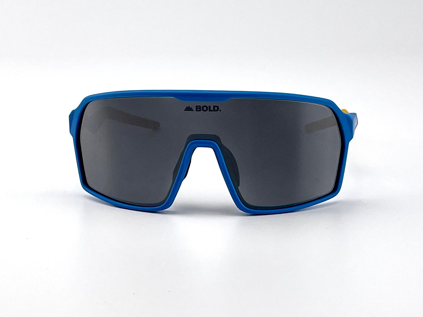 A pair of BOLD Glow Photochromic Sunglasses from boldouterwear, featuring a blue frame and large dark wraparound lenses with the logo printed in black on the lens center, shown against a plain white background.