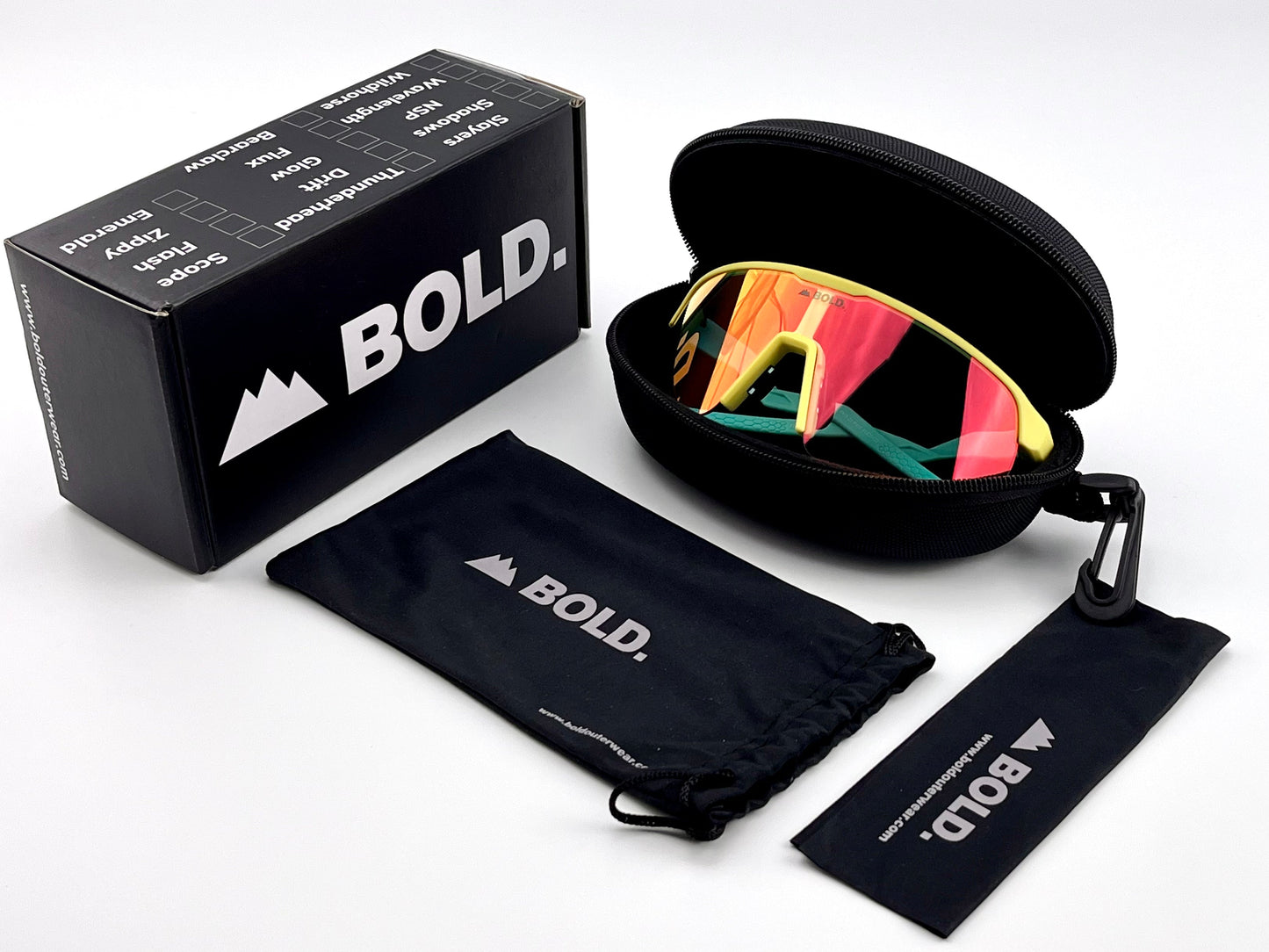 A pair of BOLD Flash Photochromic Sunglasses by boldouterwear in a black hard case sits next to a BOLD-branded box, soft pouch, and cleaning cloth, all on a white background. Designed for MTB, skiing, and lifestyle use.