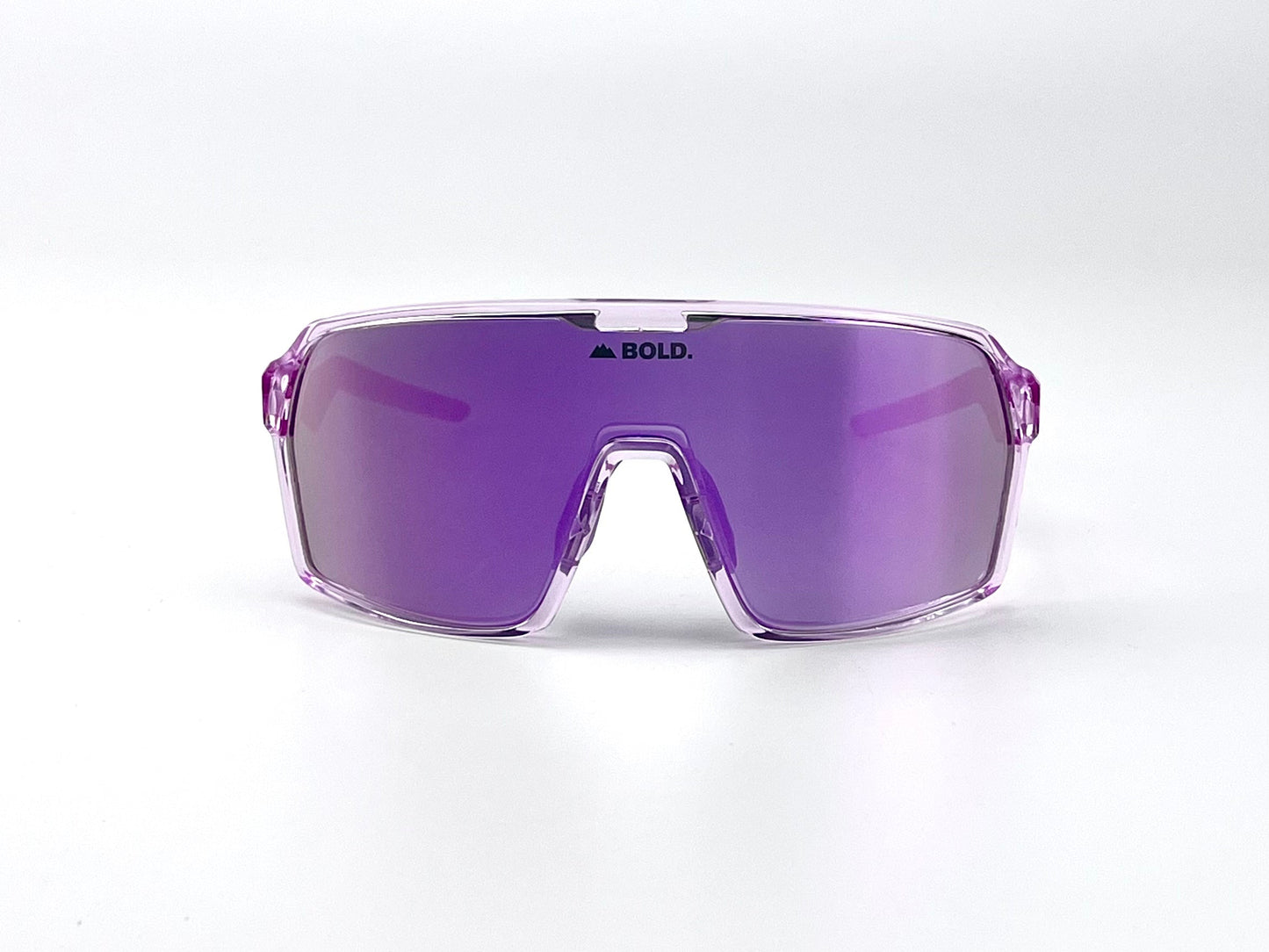 Front view of BOLD Glow Photochromic Sunglasses by boldouterwear, featuring a sporty purple wraparound lens, bold frame, reflective finish, and “BOLD.” printed in black at the lens center. Background is plain white.
