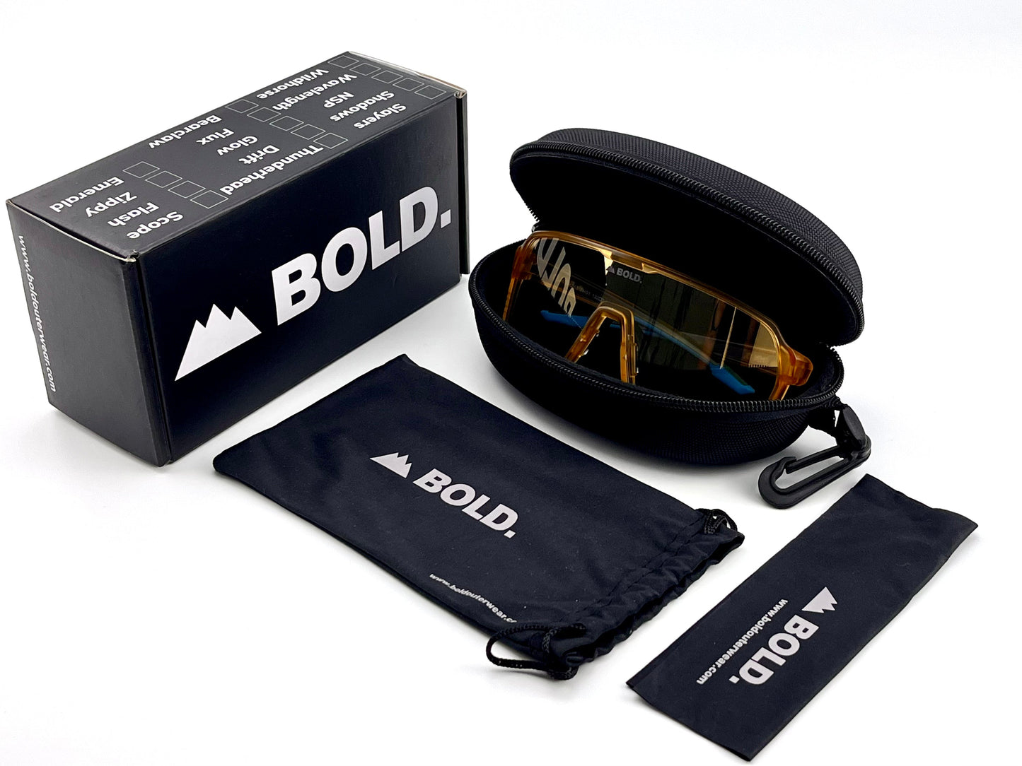 The BOLD Drift Photochromic Sunglasses by boldouterwear, plus a hard-shell case, soft pouch, and lens cloth—each sporting the boldouterwear logo—are displayed on a white background.