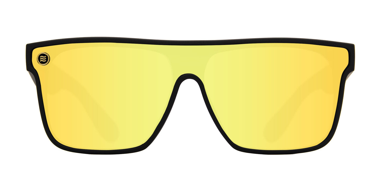 The Neven Eyewear CWM XL sunglasses feature an oversized flat-top black frame, a single yellow reflective UV-protective lens with a small circular logo on the top left, all set against a plain white background.