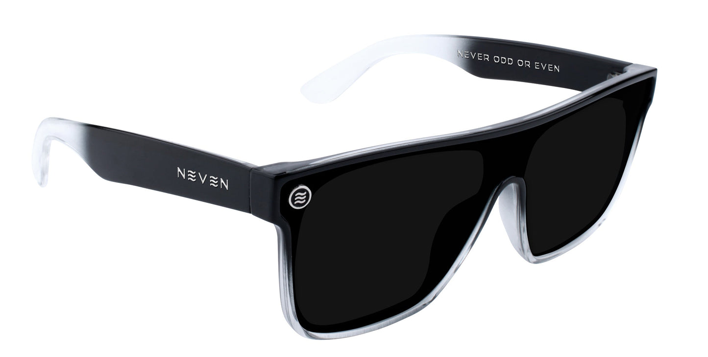 The Jordan XL sunglasses by Neven Eyewear feature a modern oversized glossy black frame, clear sides, large dark UV-protective lenses, NEVEN in white on the left temple, and “NEVER ODD OR EVEN” inside the right temple arm.