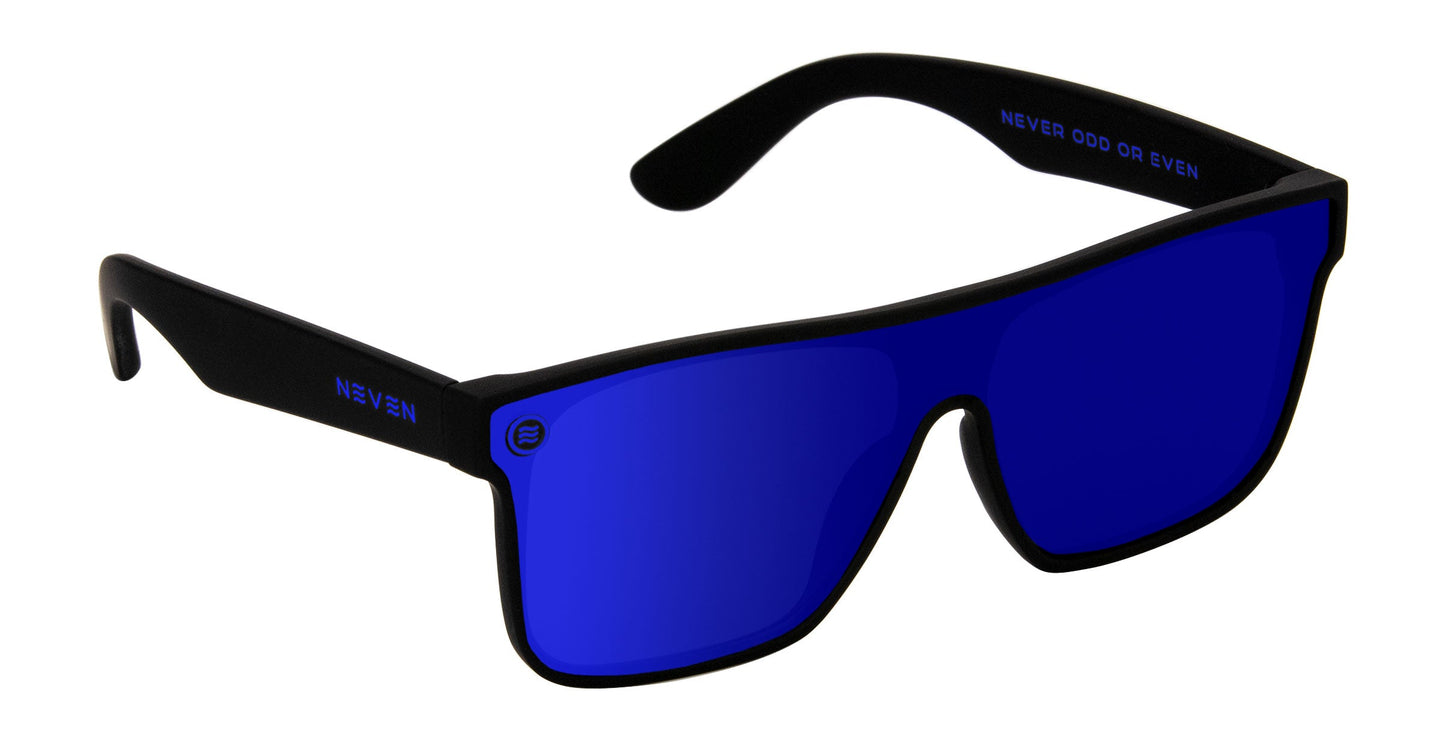 The Neven Eyewear Midnight XL features black frames, oversized rectangular reflective blue lenses with UV protection, "NEVEN" on the left arm, and "NEVER ODD OR EVEN" inside the right arm. Shown on a plain white background.