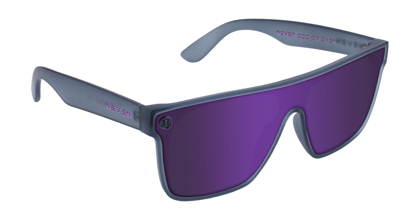 The Neven Eyewear 53X sunglasses feature a matte gray wraparound frame, deep purple reflective UV400 lenses, and "NEVER GOD OR EVEN" in light purple inside the arms with "NEVER" in white on the left arm. Impact-resistant design.