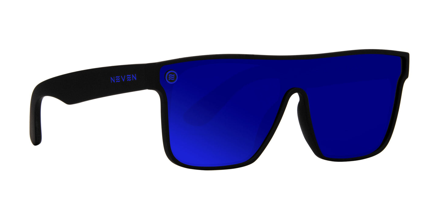 Neven Eyewear’s Midnight sunglasses feature black frames, large rectangular solid blue polarized lenses with UV400 protection, NEVEN in white on the left arm, and a small circular logo on the upper left lens.