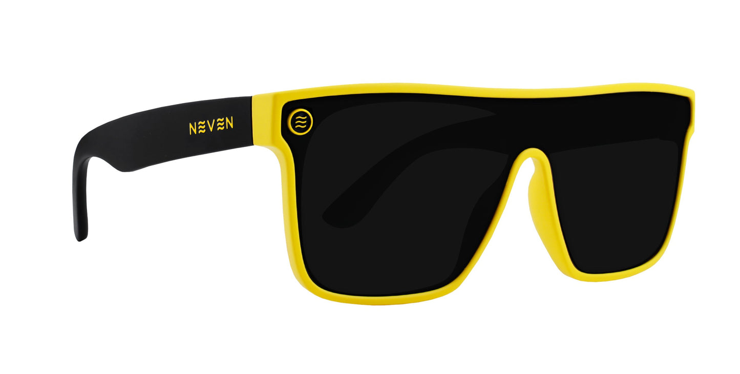 The Swarm by Neven Eyewear features oversized rectangular UV400 lenses, a bold yellow frame, black arms with “NEVEN” in yellow, and a small circular logo on the left lens.