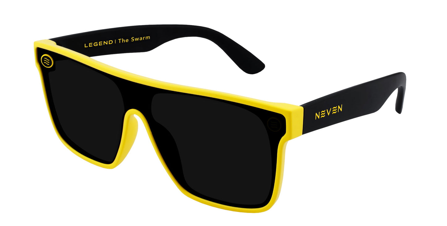 The Swarm by Neven Eyewear features thick, rectangular yellow frames with black inside arms and yellow text. These polarized sunglasses offer UV400 protection, dark lenses, and a bold modern style.