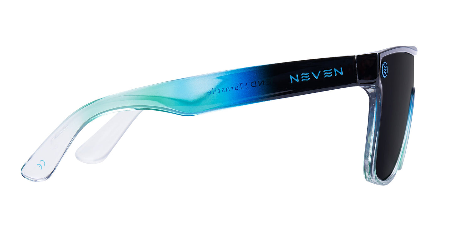 A pair of polarized sunglasses from Neven Eyewear, called Turnstile, with black impact-resistant lenses and transparent frames fading from clear to blue, teal, and black. Features a white NEVEN logo and "END Turnstile" on the inner right temple.
