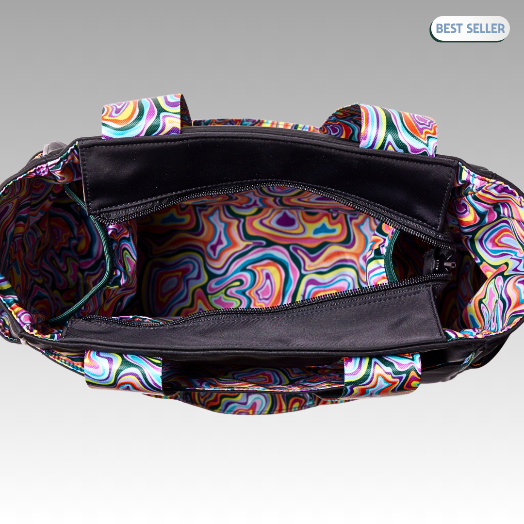 The Lulu Pickleball Tote by Playly Store is a multicolored purse with a zipper, ideal as a stylish pickleball accessory or tote for carrying your essentials.