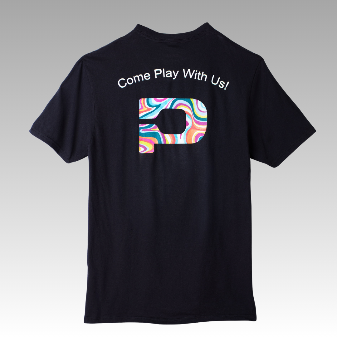 The Playly Store's Playly - Logo T is a black unisex cotton pickleball tee featuring "Come Play With Us!" in white above a bold rainbow swirl D on the upper back, set against a smooth gray gradient background.
