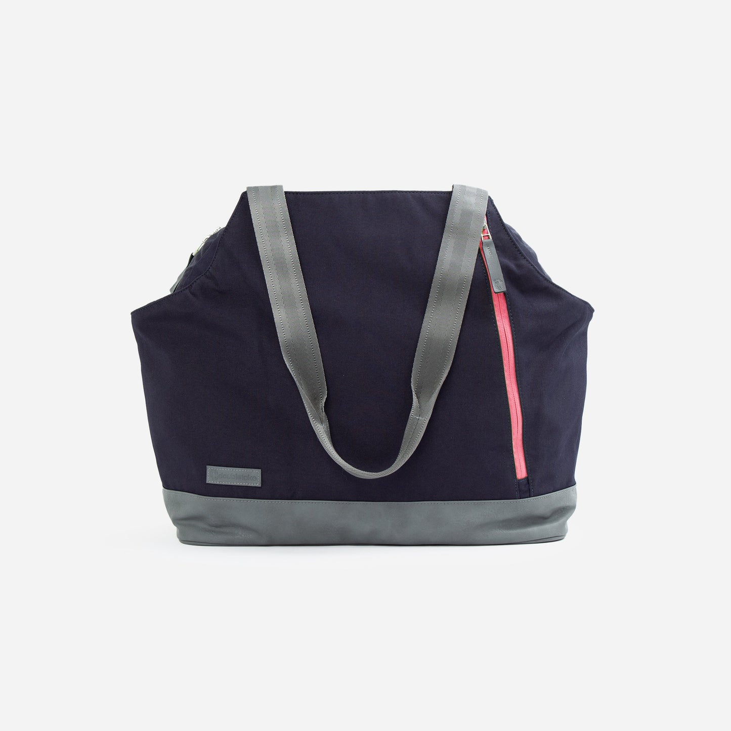 The Doubletake LONDON Pickleball Duffel & Tote is a large navy blue bag with gray handles and base, featuring a slanted pink zipper pocket, ample storage, and a small gray patch on the bottom. Shown on a plain white background.