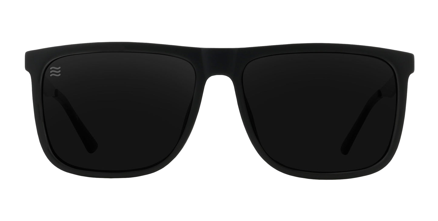 The Blueprint by Neven Eyewear are black polarized sunglasses with rectangular frames, dark lenses, a solid matte rubberized finish, and a small logo on the upper left lens. They offer UV protection and stand out against a plain white background.