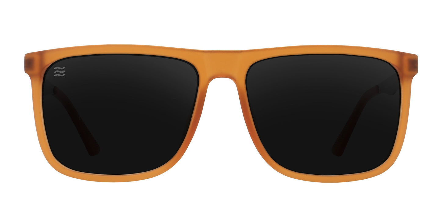 Front view of Neven Eyewear Suggestion sunglasses featuring an orange frame, large square black lenses with a translucent matte finish, partially visible arms, and a small white logo on the upper left corner of the left lens.