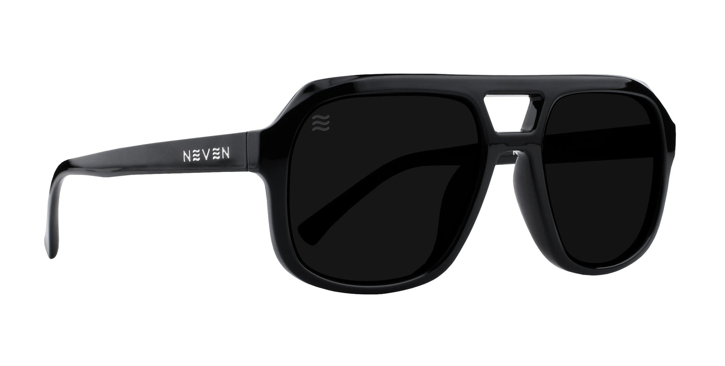 Cosmo by Neven Eyewear: black oversized sunglasses with thick frames, dark polarized UV400 lenses, and a modern rectangular bridge cutout. The left arm displays the NEVEN logo in white.