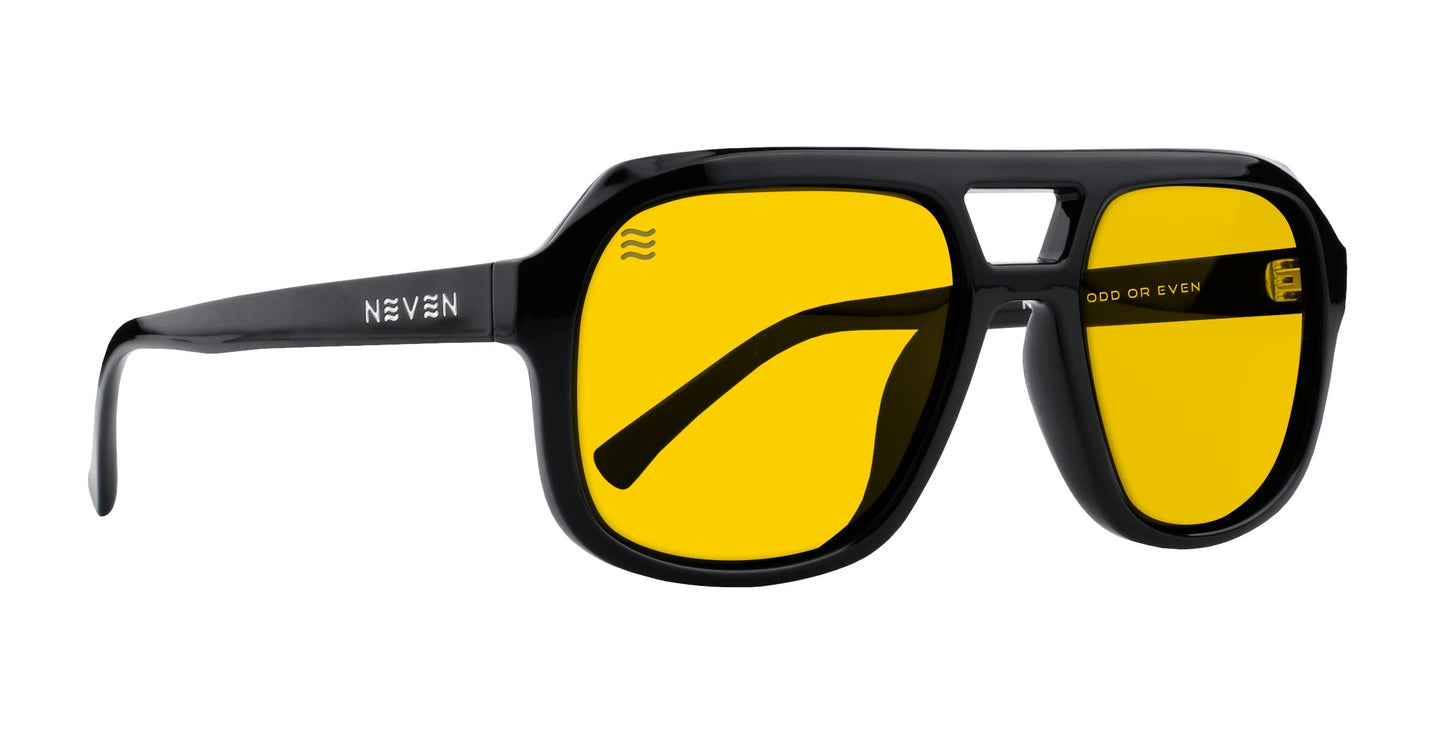 The Helios by Neven Eyewear features black frames and yellow UV400 lenses. The left temple is branded with “Neven” in white, while a sporty geometric shape and subtle ODD OR EVEN logo complete the modern look.