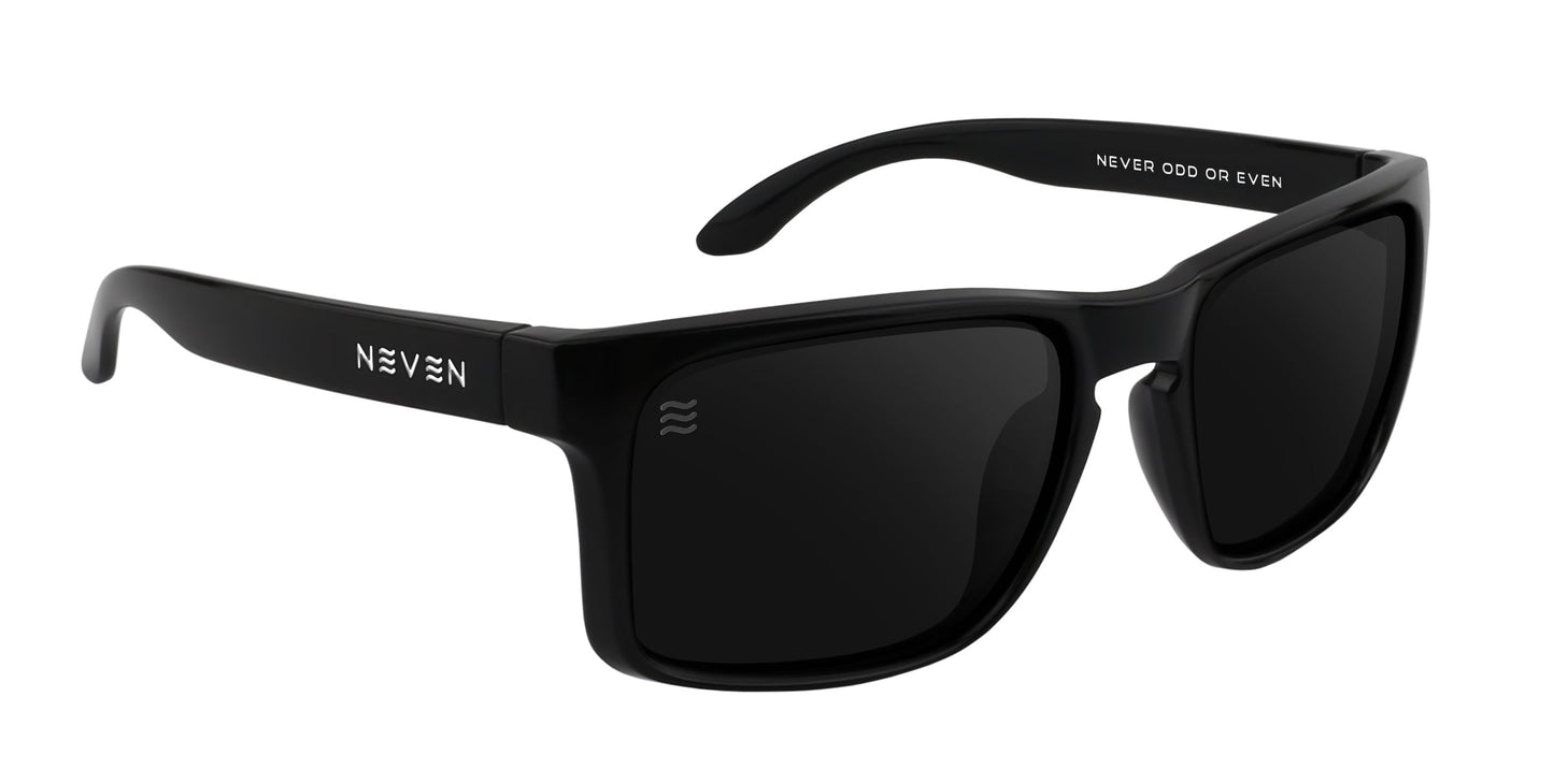 The Doom XL sunglasses by Neven Eyewear are black and rectangular with dark polarized lenses for stylish UV protection. The left temple features the white “NEVEN” logo; the right arm’s interior reads “NEVER ODD OR EVEN.”.