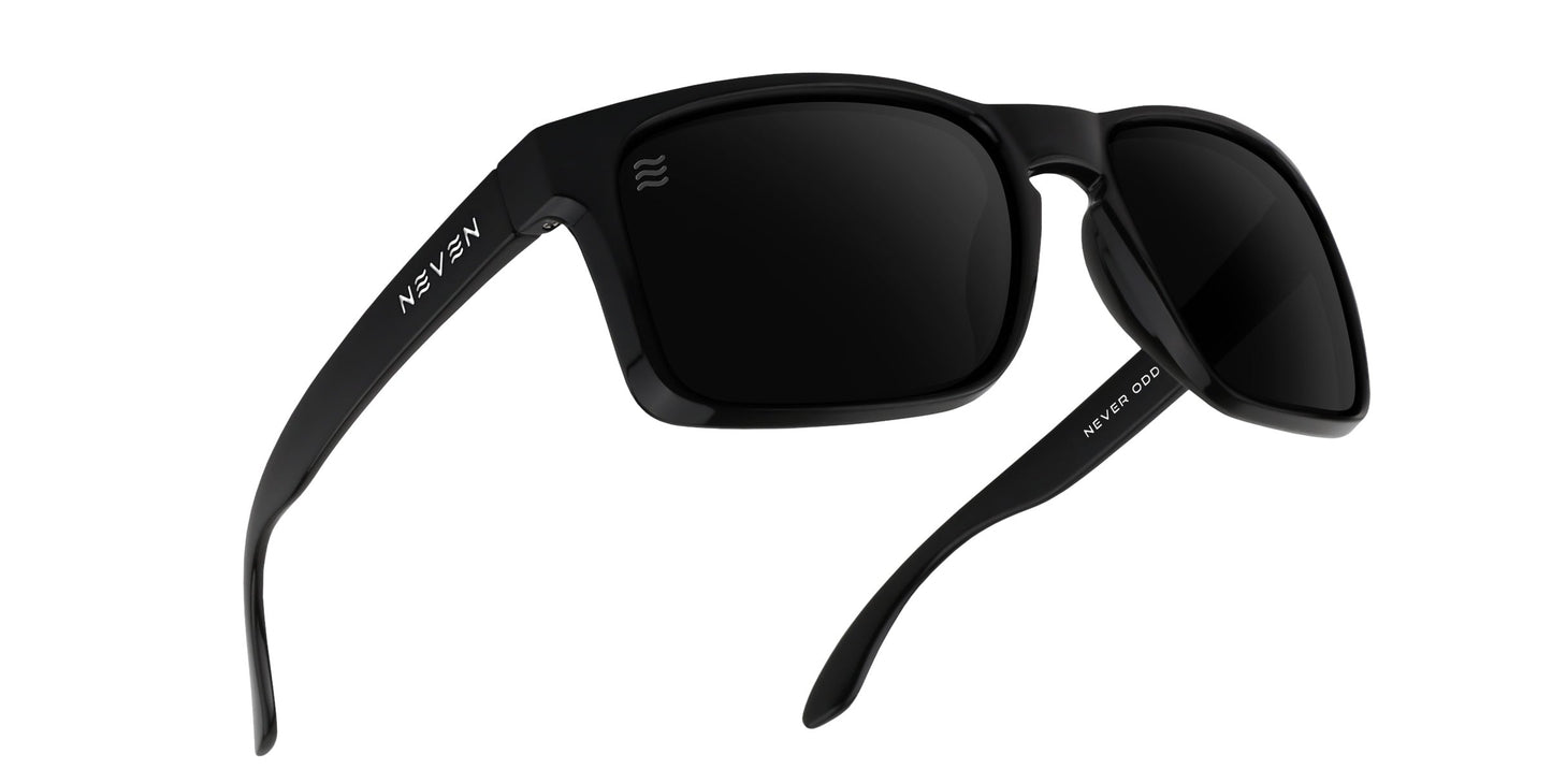 A pair of black rectangular Doom XL sunglasses from Neven Eyewear with thick frames, dark polarized lenses, and UV protection. "KEAN" is printed on the left temple; "KEAN E-090" appears on the right. Displayed on a white background.