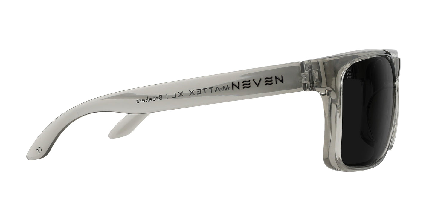 Side view of Breakers XL oversized sunglasses for large heads by Neven Eyewear, featuring transparent gray frames and black lenses. "MATTE X XL" and "Neven" are printed in black on the thick, curved arm for a secure fit.