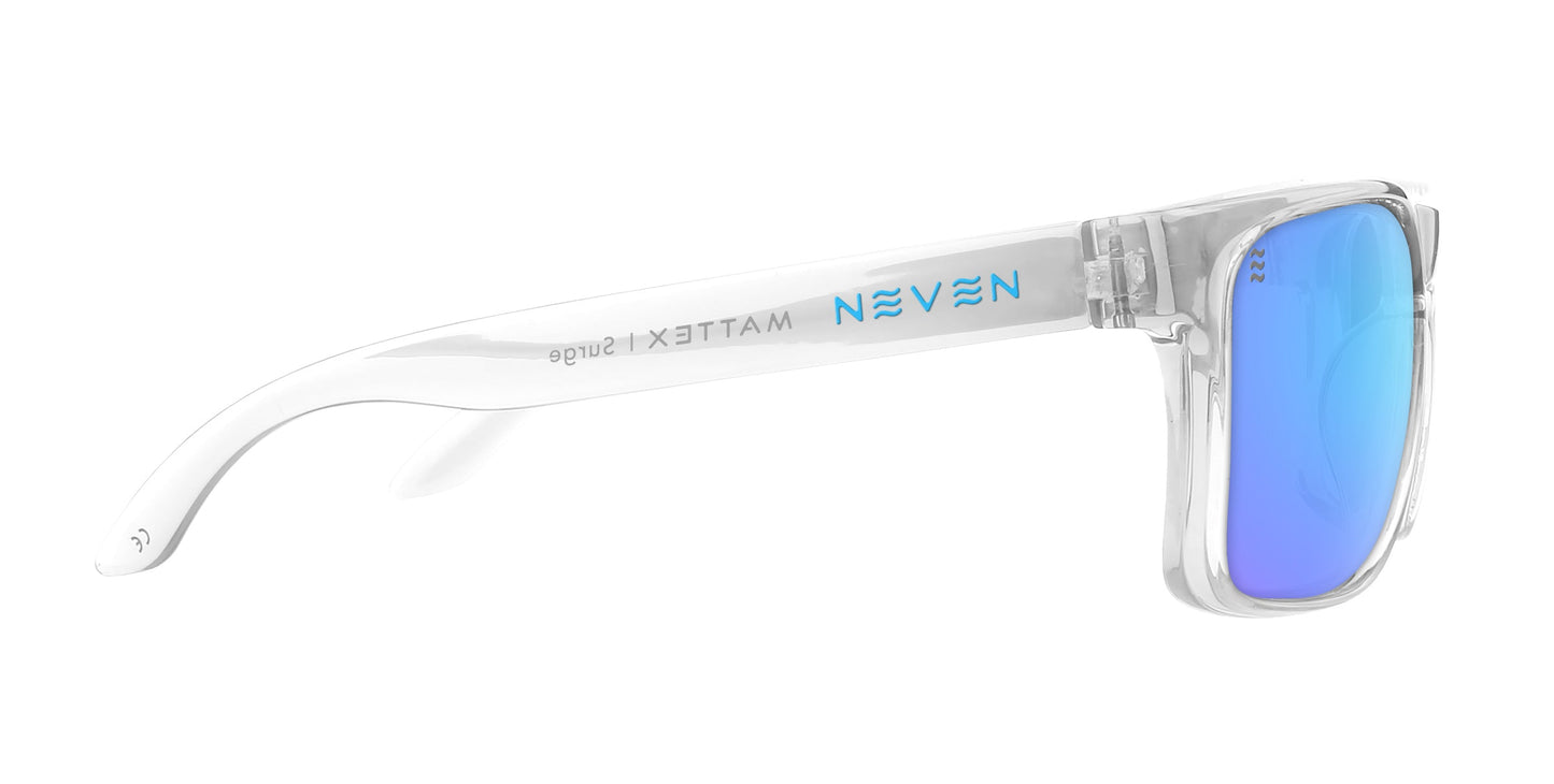The Surge sunglasses by Neven Eyewear feature a clear, transparent frame with blue mirrored UV400 lenses. Seen from the side, the arm displays light blue “NEVEN” and grey “MATTE X Sliingz” branding against a plain white background.