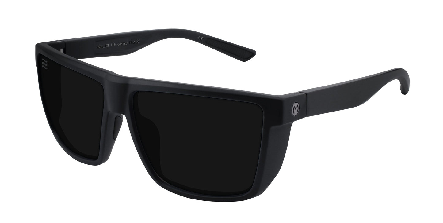 A pair of Honey Hole sunglasses by Neven Eyewear with matte black rectangular frames, thick build, dark polarized UV400 lenses, straight slightly curved arms, and a small circular logo by the hinges set against a white background.