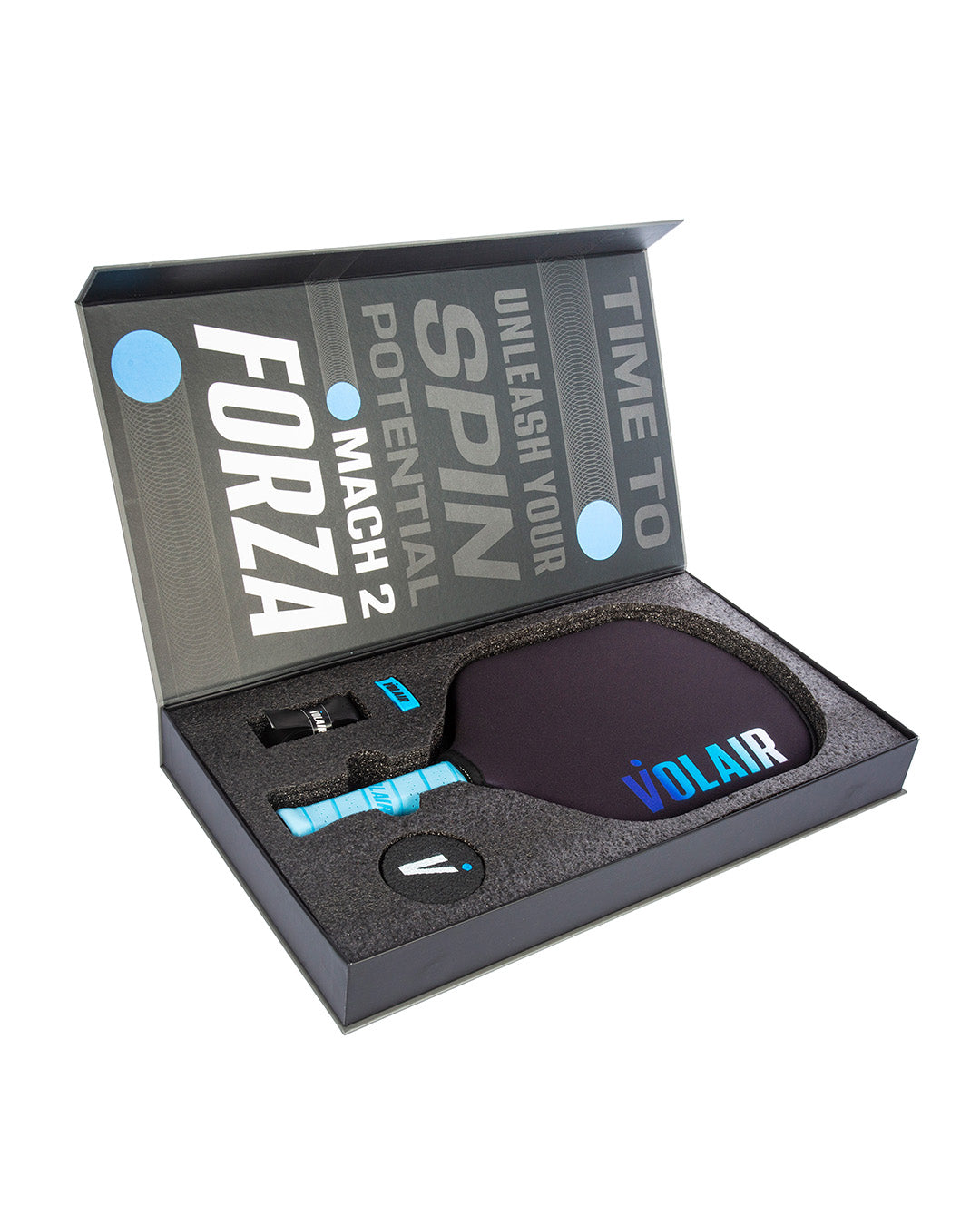 An open black box displays the Volair Pickleball Mach 2 Forza paddle with a blue and black handle, cover, wrist strap, tool, and two overgrips. The lid says: “TIME TO UNLEASH YOUR SPIN POTENTIAL - MACH 2 FORZA.”.