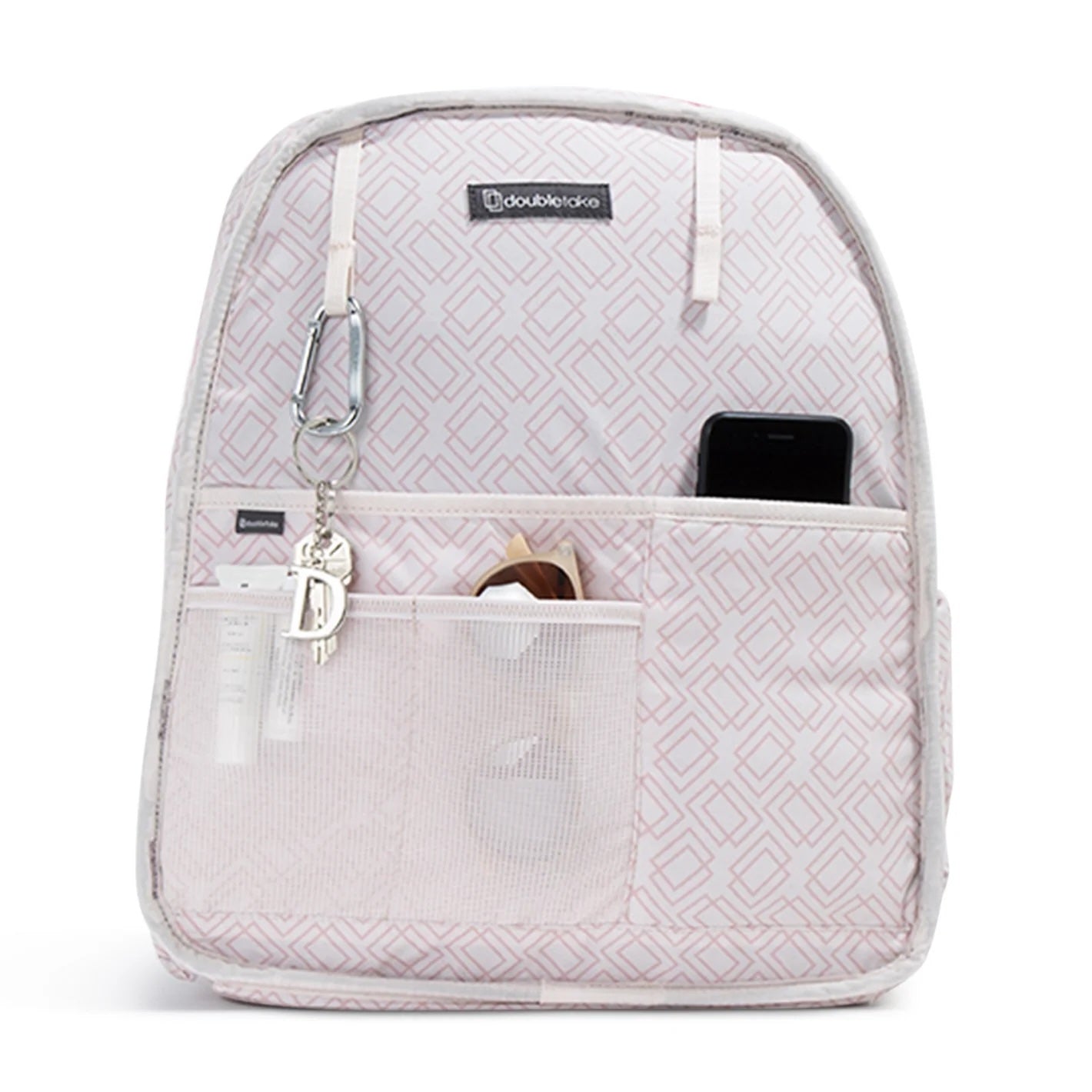 The MELBIE | Pickleball Backpack & Tote by Doubletake comes in light pink with a geometric square pattern, mesh front pockets for essentials like keys and phone, plus the Doubletake logo at the top center.