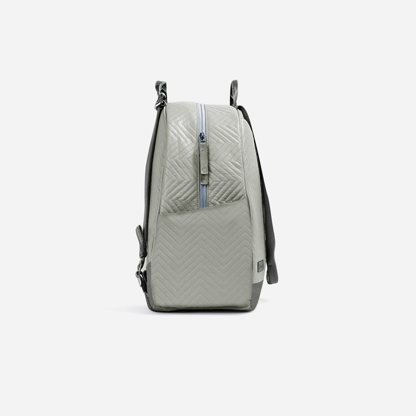 The MELBOURNE Pickleball Backpack & Tote by Doubletake is shown from the side against a white background, featuring light gray quilted fabric with a chevron pattern, side zipper, and black adjustable shoulder strap with metal hardware.
