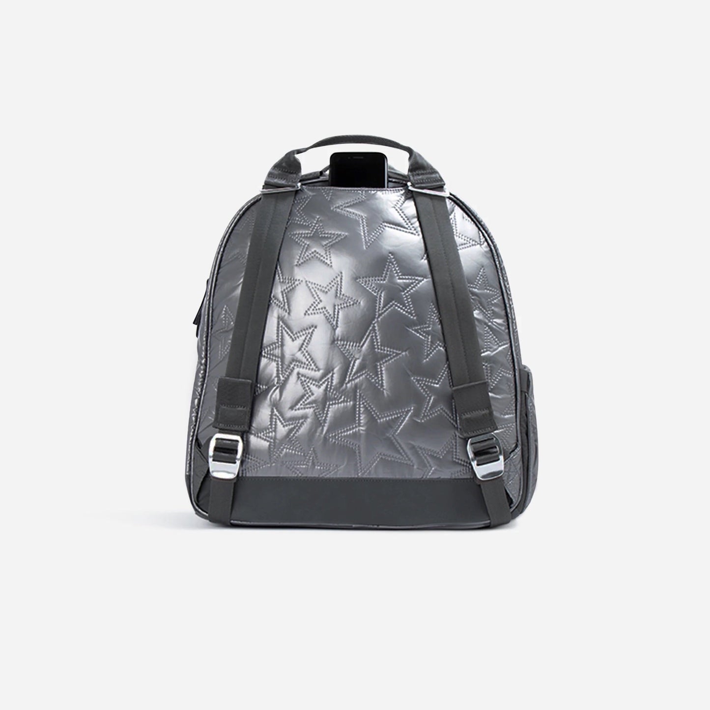The Doubletake MELBOURNE Pickleball Backpack & Tote features a metallic silver finish with embossed star patterns, black adjustable straps, top handle, and silver buckles. Its tip-free design is stylish and practical against a plain white background.