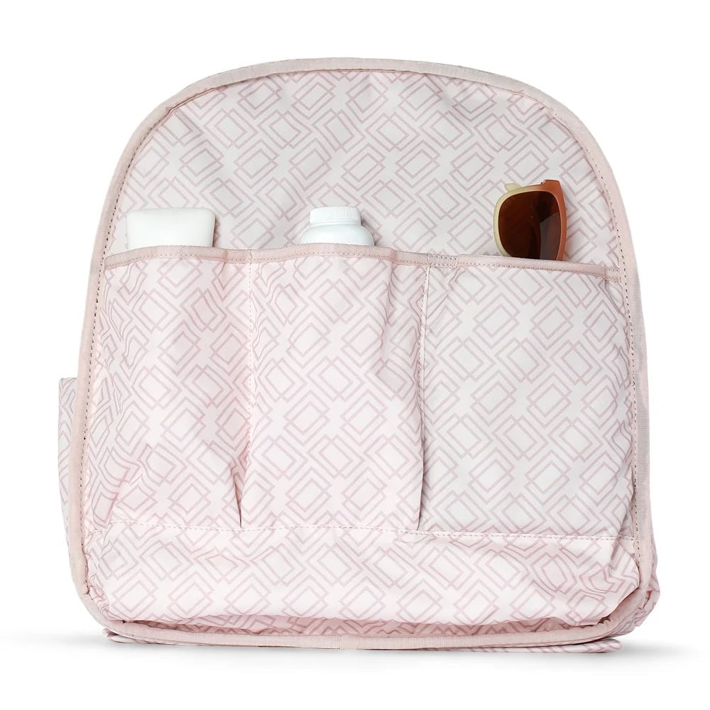 The Doubletake MELBOURNE Pickleball Backpack & Tote features a pink and white geometric pattern, multiple open pockets for a bottle, cylinder, and sunglasses. Its tip-free design keeps items upright and empty pockets visible.