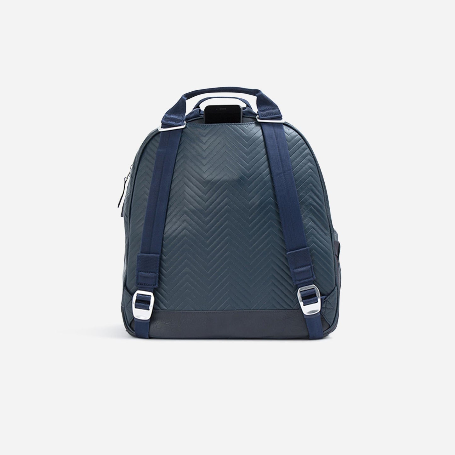 The Doubletake MELBOURNE Pickleball Backpack & Tote in dark teal chevron stands upright on a white background, showcasing navy straps, silver buckles, water-resistant finish, top handle, padded shoulder straps, and a modern structured design.