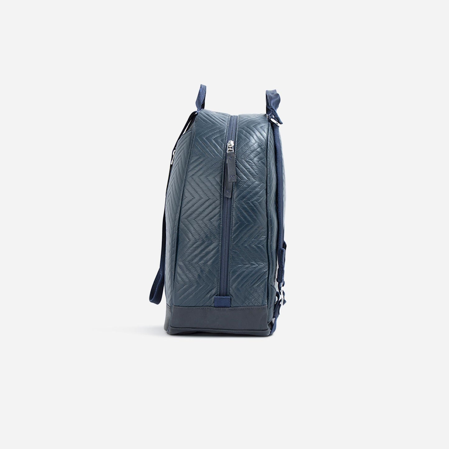 Side view of the MELBOURNE | Pickleball Backpack & Tote by Doubletake in blue, featuring a water-resistant quilted chevron design, zipper closure, two handles, and a darker blue tip-free bottom. Shown on a plain white background.