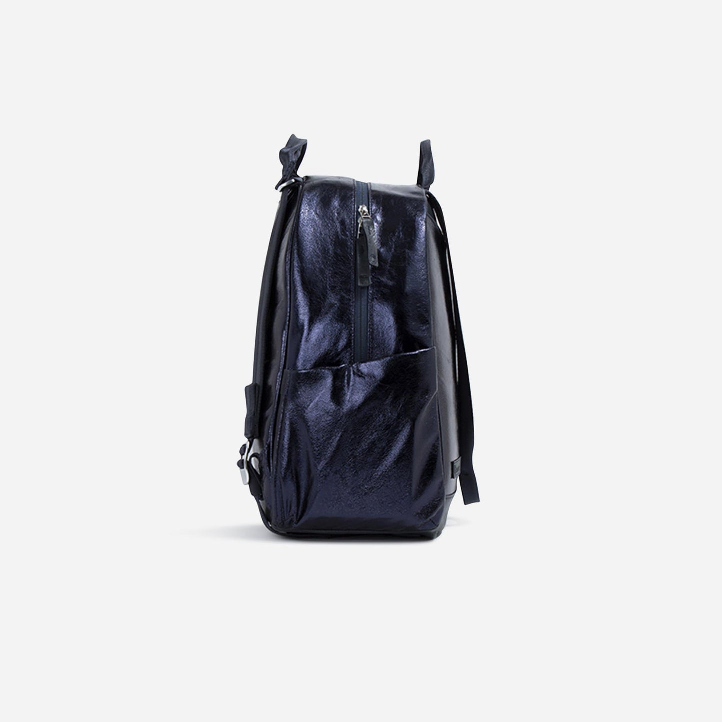 The Doubletake MELBOURNE Pickleball Backpack & Tote in shiny dark navy blue stands upright, side view, against a white background. It features a zippered main compartment, side pocket, water-resistant fabric, and black adjustable straps.