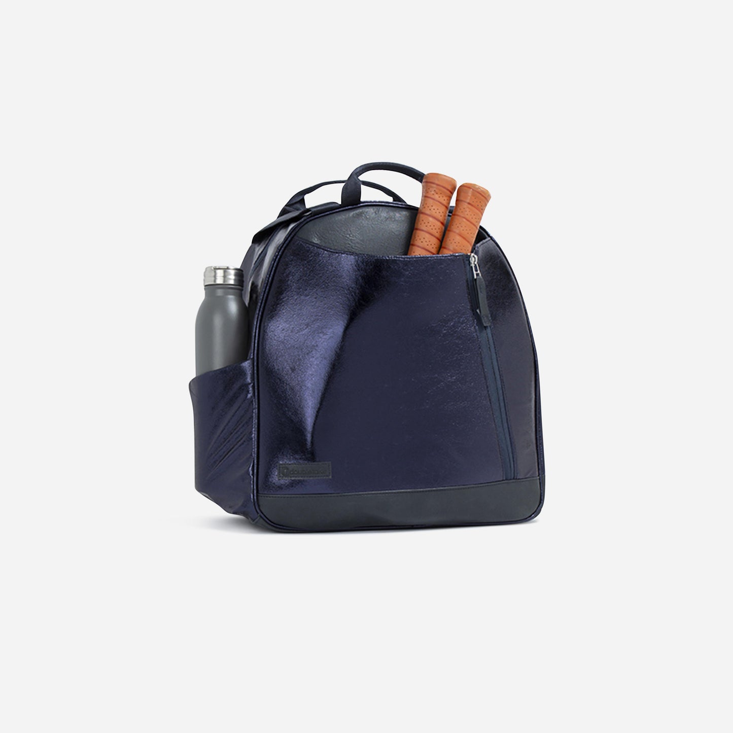 The Doubletake MELBOURNE Pickleball Backpack & Tote in shiny navy features a tip-free design, front zip pocket for two wooden handles, and side pocket with a silver reusable water bottle. Shown on plain white background.