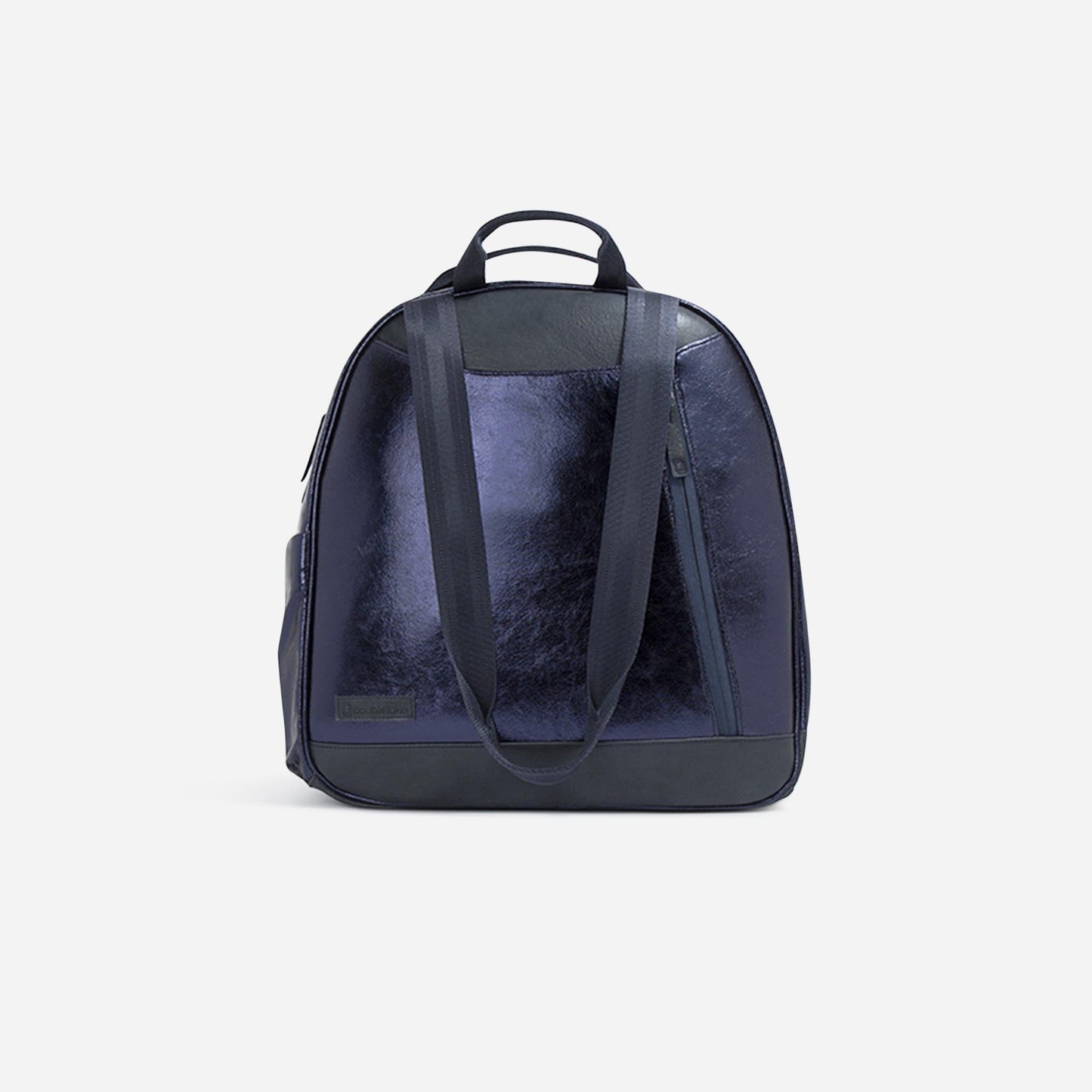 The MELBOURNE Pickleball Backpack & Tote by Doubletake is a deep navy blue leather bag with a glossy, water-resistant finish, black straps, a top handle, and a diagonal front zipper pocket, shown on a plain white background.