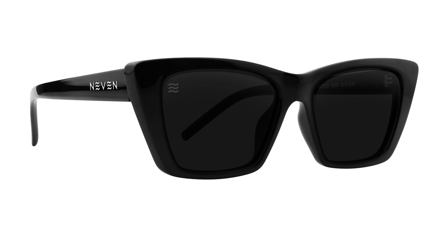 Noir by Neven Eyewear: Black oversized square sunglasses with thick glossy frames, dark polarized UV400 lenses, and a silver NEVEN logo on the temples. Bold modern style meets French elegance for a true high-fashion statement.
