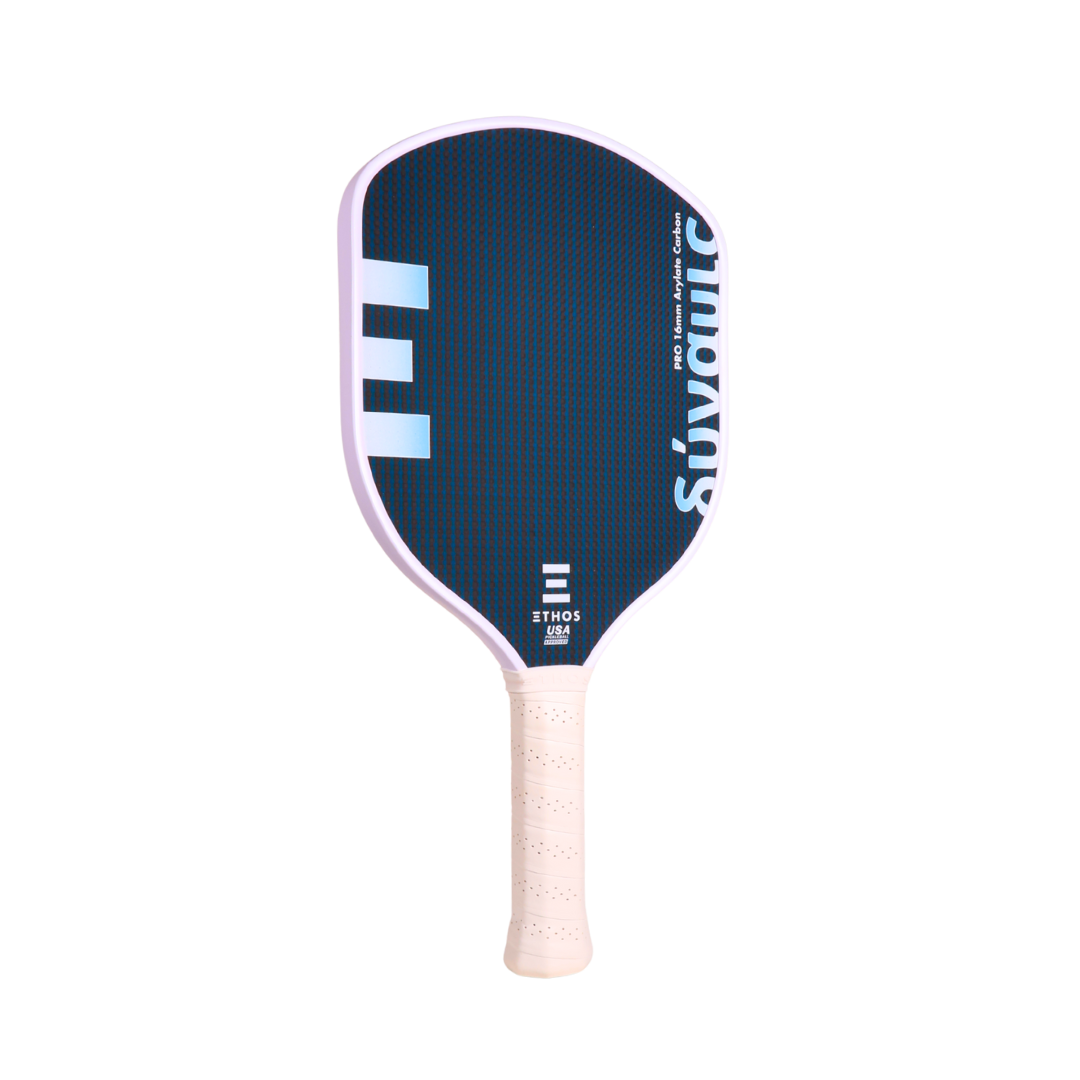 The Ethos Pickleball Dunamis Pro by Ethos Pickleball features a Vectran Arylate Carbon face in navy blue with white edges and handle, light blue and white geometric accents, “Suvantic” branding, and a textured grip for great vibration dampening.