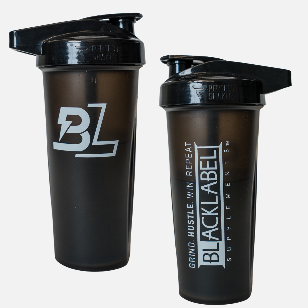 Two BLACKLABEL Performa Shakers from BLACKLABEL Supplements are shown: the left has a bold BL logo, and the right reads "GRIND. HUSTLE. WIN. REPEAT. BLACKLABEL SUPPLEMENTS." Both have Performa Shaker logos on their black lids.