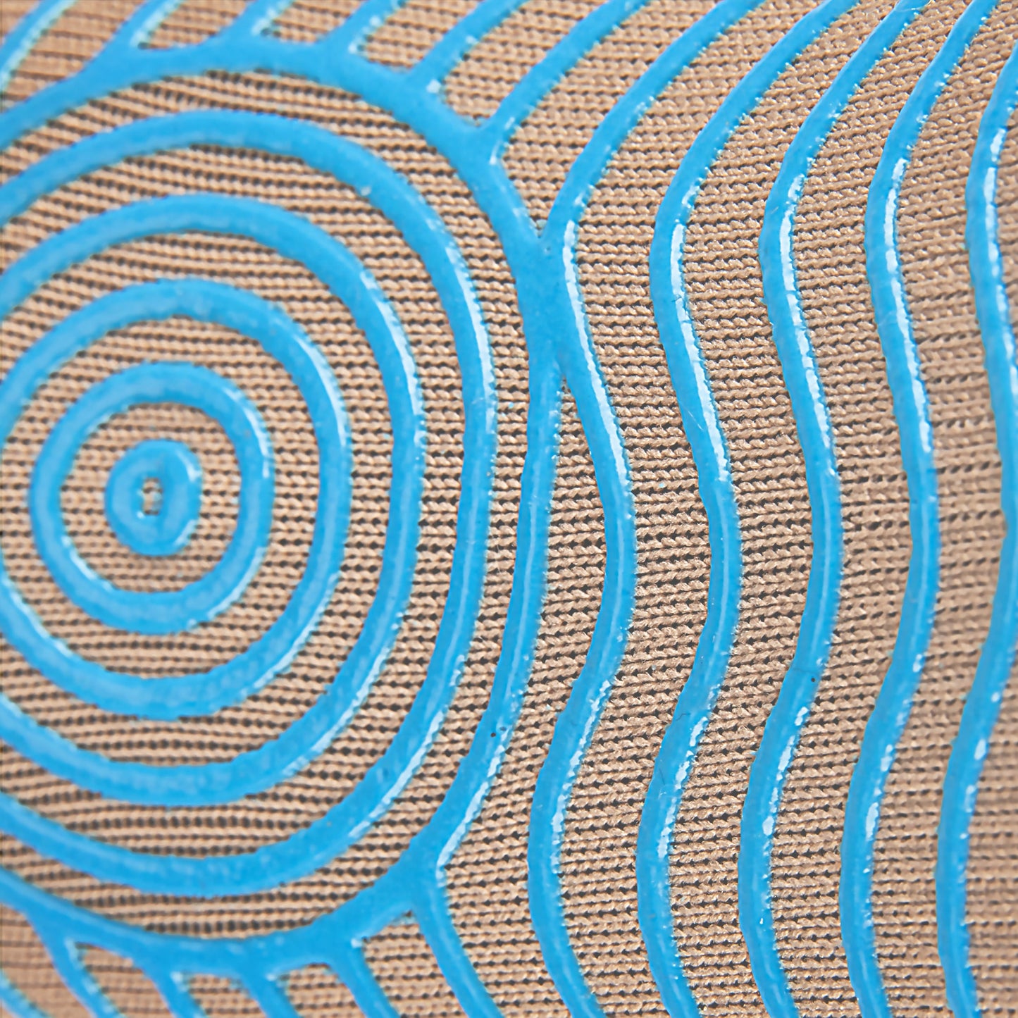 Close-up of GripSocks Athletic Socks with Grips—Ankle Sock in beige—showing textured fabric with raised, shiny blue concentric and wavy patterns for a tactile, visually dynamic design that enhances grip like quality non-slip socks.