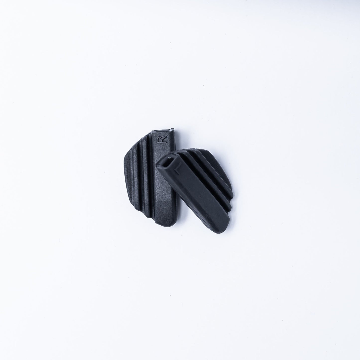 A black FOCOS ANKR™ Nose Pad by BRIOTI on a white background, perfect for FOCOS eyewear or as replacement nose pads.
