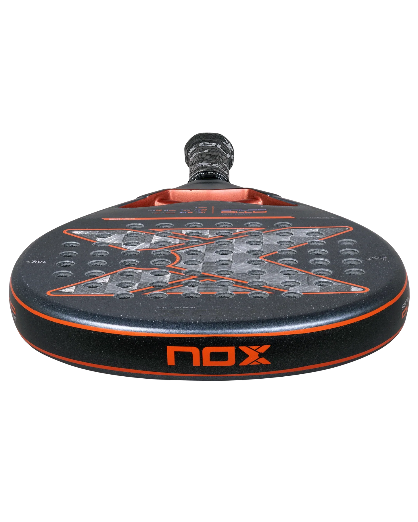 A close-up front view of the Padel USA Nox AT10 Luxury GENIUS 18K Alum by Agustín Tapia shows its round black face with an orange “X,” multiple circular holes, EXCLUSIVE SPIN tech, and a handle wrapped in black grip tape.
