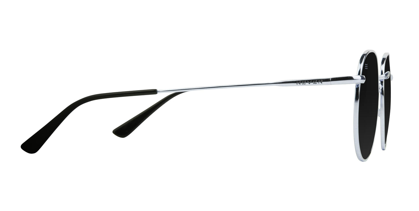 Side view of Neven Eyewear's Ivy aviator sunglasses featuring thin stainless steel frames, black ear tips, circular polarized UV400 lenses, and a metallic rim, all set against a plain white background.