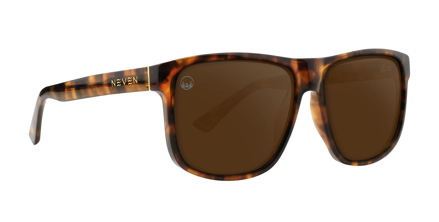 Ember by Neven Eyewear features classic tortoiseshell frames with amber, brown, and dark spots, large rectangular lenses with a brown tint and glossy finish, plus UV400 protection for your eyes.