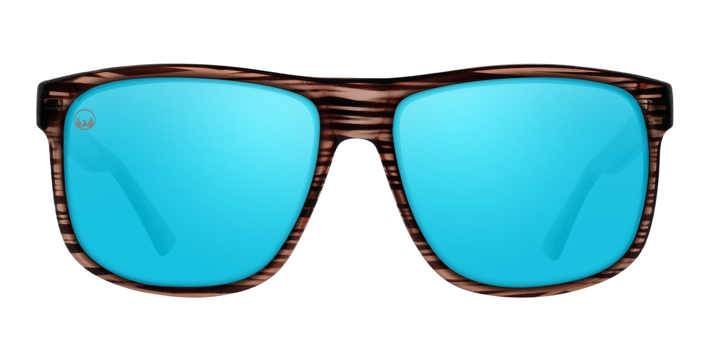 The Neven Eyewear Solana sunglasses from the Phoenix Collection feature shiny blue mirrored polarized lenses and a brown/black wood-grain frame, shown from the front with both lenses clearly visible.