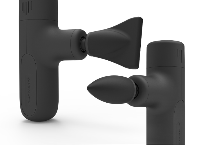 Two black iReliev MVPmini DynamicDuo massage guns are shown, each matte and minimalistic. One uses the Edge Massage Head for IT Band Syndrome, the other the Bullet Head. Both heads fit MVPmini models; PLAYMAKR branding is visible.