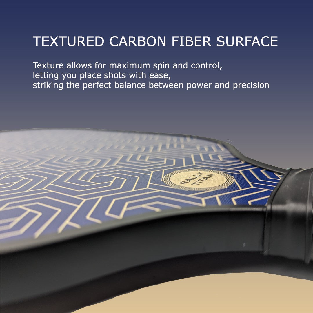 Close-up of the Rally Titan Pickleball Blue Hex paddle, showcasing its blue and gold geometric T300 textured carbon fiber surface for enhanced spin and control. A gold emblem near the handle hints at its 10MM polypropylene honeycomb core.