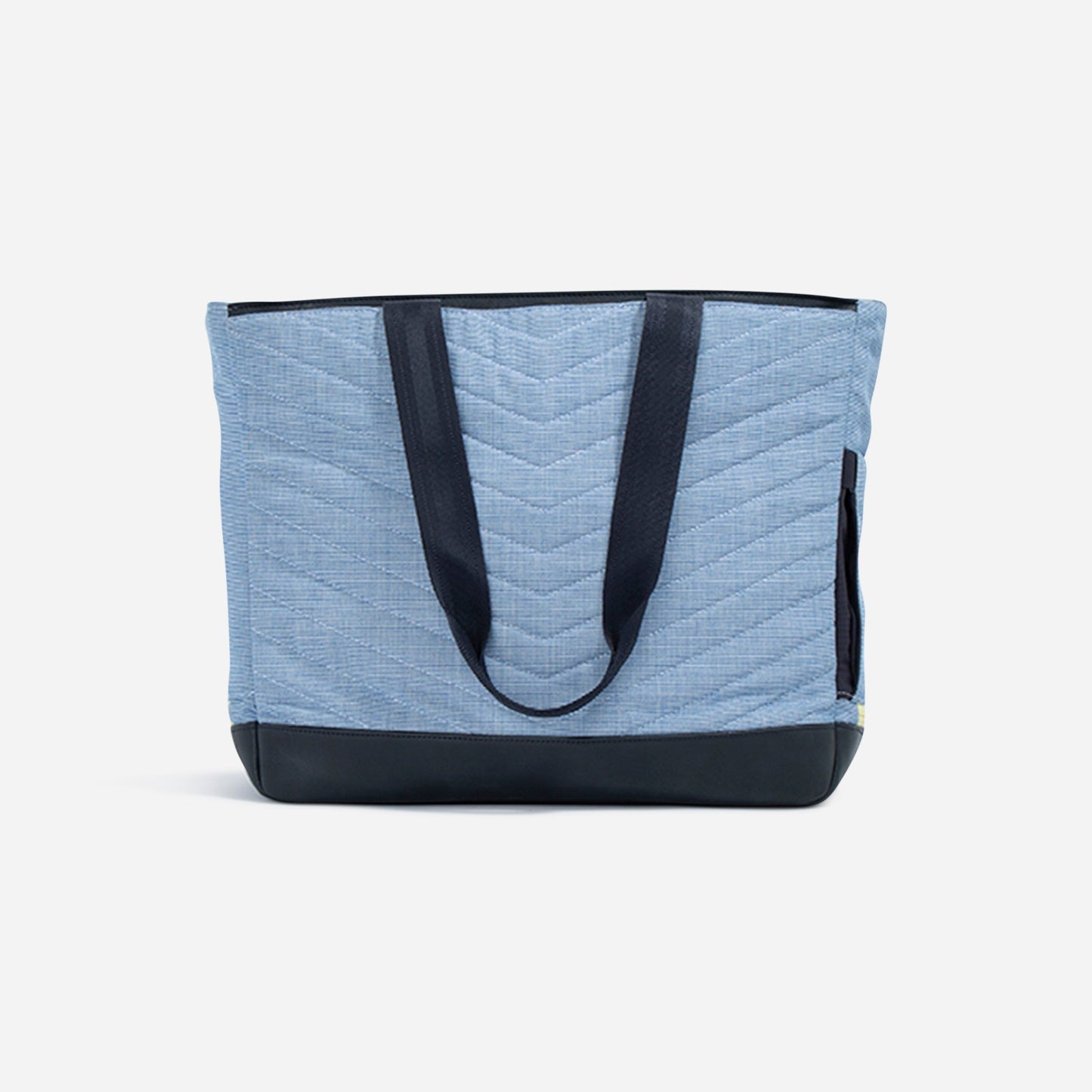 The Doubletake PARISII Pickleball Tote features a large light blue quilted chevron design, black handles, and a black leather-like base. Perfect for pickleball or tennis, its stylish details pop against a plain white background.